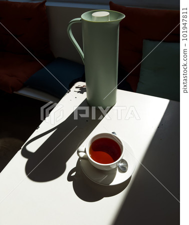 Tea set in the cafe hard light with harsh shadows Tea set in the cafe hard light with harsh shadows 101947811