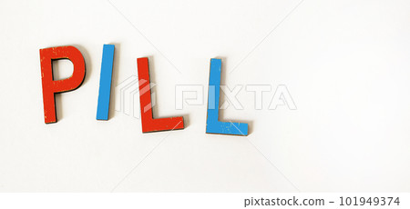 The word PILL consists of wooden colored letters on a white background. 101949374