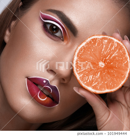 Beautiful caucasian woman with creative makeup and purple lips. Beauty face. Art makeup. Beautiful caucasian woman with creative makeup and purple lips. Beauty face. Art makeup. 101949444