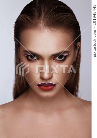 Beautiful caucasian woman with creative makeup and purple lips. Beauty face. Art makeup. Beautiful caucasian woman with creative makeup and purple lips. Beauty face. Art makeup. 101949449