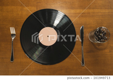 Music lover breakfast. Vinyl record and audio cassette instead food Music lover breakfast. Vinyl record and audio cassette instead food 101949713
