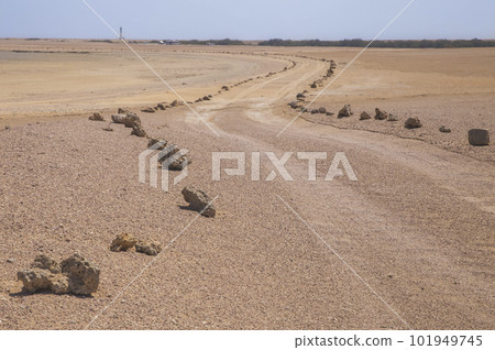 Improvised road, fenced by stones in Africa 101949745