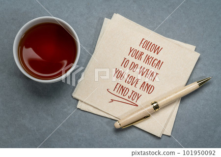 follow your ikigai - to do what you love and find joy - inspirational handwriting on a napkin with tea, Japanese concept of a life purpose follow your ikigai - to do what you love and find joy - inspirational handwriting on a napkin with tea, Japanese concept of a life purpose 101950092