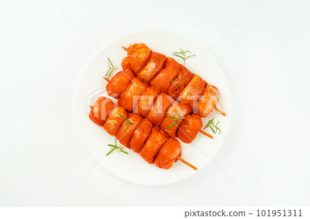 Closeup of chicken meat.Procurement for designers.Fresh raw marinated chicken leg meat skewers without skin on a white background.Marinated Fresh.Chicken Skewers meat. Closeup of chicken meat.Procurement for designers.Fresh raw marinated chicken leg meat skewers without skin on a white background.Marinated Fresh.Chicken Skewers meat. 101951311