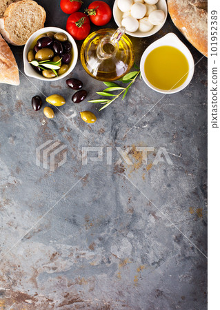 Olive oil in vintage bottles and italian cuisine ingredients 101952389