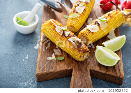 Grilled corn with chili and cheese Grilled corn with chili and cheese 101952852