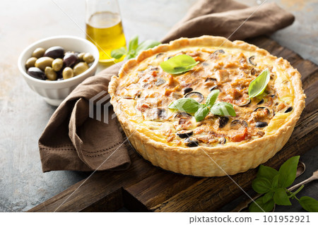 Quiche with eggplant, chicken and olives 101952921