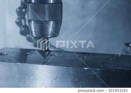 The CNC milling machine chamfer cutting mold base part by chamfer tool in the light blue scene. The CNC milling machine chamfer cutting mold base part by chamfer tool in the light blue scene. 101953281