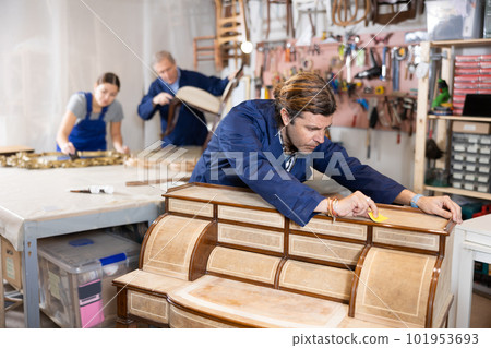 Male furniture workshop worker designing vintage chest of drawers Male furniture workshop worker designing vintage chest of drawers 101953693