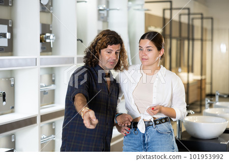 in plumbing department, couple thought about choosing suitable bathroom for new apartment in plumbing department, couple thought about choosing suitable bathroom for new apartment 101953992