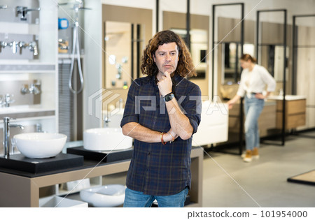 in plumbing department, man thought about choosing suitable bathroom for new apartment 101954000