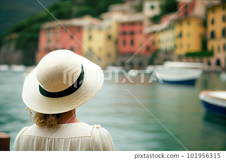 Girl in a white hat admiring Portofino Italy. Generative AI, Generative, AI Girl in a white hat admiring Portofino Italy. Generative AI, Generative, AI 101956315