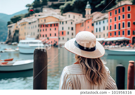Girl in a white hat admiring Portofino Italy. Generative AI, Generative, AI Girl in a white hat admiring Portofino Italy. Generative AI, Generative, AI 101956316