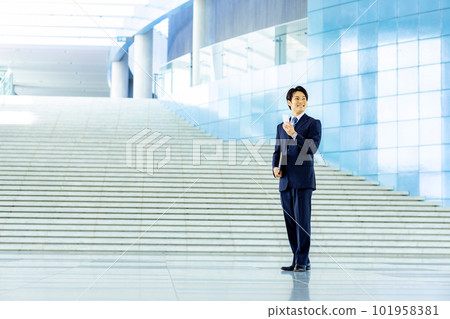A businessman with a smartphone 101958381