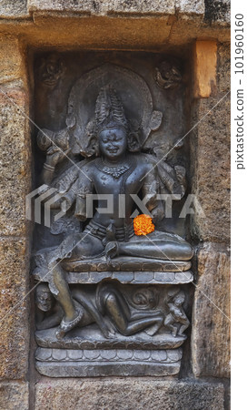 Carving Sculpture of Lord Shiva on the Chausath Yogini Temple of Hirapur, Temple is dated 8-9th Century A.D. Built by Queen Hiradevi of Bhauma Dynasty, Bhubaneshwar, Odisha, India. 101960160