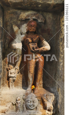 Katayani Images on exterior niches of the 2m high circular temple wall. Each holding a blade in hand and a severed head at the base. Yogini Temple, Hirapur, Bhubaneshwar, Odisha, India. 101960221