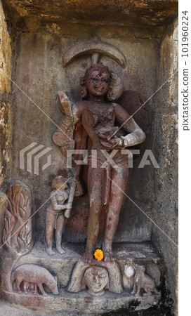 Katayani Images on exterior niches of the 2m high circular temple wall. Each holding a blade in hand and a severed head at the base. Yogini Temple, Hirapur, Bhubaneshwar, Odisha, India. 101960224