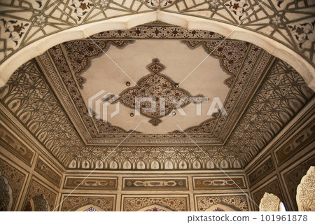 Colourful painting on the inner wall of Hawa Mahal or Wind Palace, built from red and pink sandstone. It is akin to a honeycomb with its 953 small windows called Jharokhas decorated with intricate Colourful painting on the inner wall of Hawa Mahal or Wind Palace, built from red and pink sandstone. It is akin to a honeycomb with its 953 small windows called Jharokhas decorated with intricate 101961878