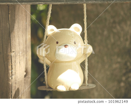 bear doll on a swing 101962149