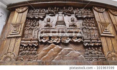 Carving of Preaching Saddharam Pundarika Sutra on the Buddha Peace Pagoda in Darjeeling, West Bengal, India. 101963599