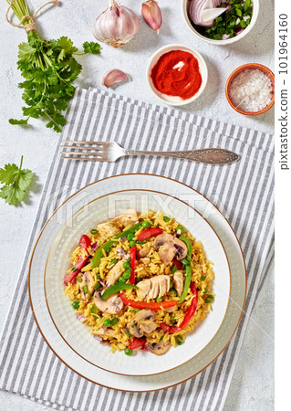 chicken mushroom paella with pepper, green peas chicken mushroom paella with pepper, green peas 101964160
