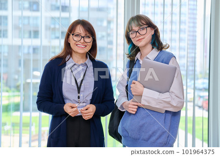 Portrait of middle aged female teacher and girl college student 101964375