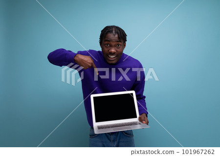 IT specialist african young brunette man with dreadlocks with laptop 101967262