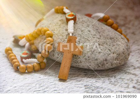 Bright light shining upon Holy Rosary. Christianity concept. Bright light shining upon Holy Rosary. Christianity concept. 101969090