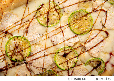 Closeup on chicken pizza with zucchini Closeup on chicken pizza with zucchini 101969150