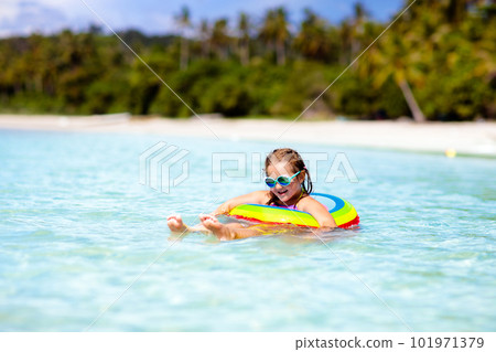 Child on tropical beach. Sea vacation with kids. Child on tropical beach. Sea vacation with kids. 101971379