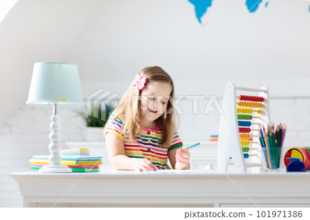 Child with abacus doing homework after school. Child with abacus doing homework after school. 101971386