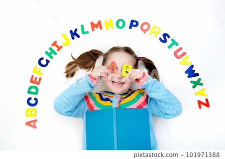 Child learning letters of alphabet and reading 101971388