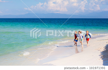 Kids playing on beach. Children play at sea. Kids playing on beach. Children play at sea. 101971391