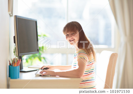 Child doing homework on computer. Online class. Child doing homework on computer. Online class. 101971530