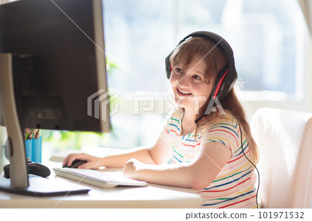 Child doing homework on computer. Online class. Child doing homework on computer. Online class. 101971532