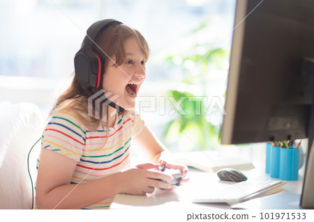 Child doing homework on computer. Online class. Child doing homework on computer. Online class. 101971533