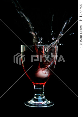Ice cube splashing in a glass 101972200