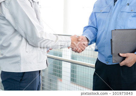 A man in work clothes shaking hands Hands 101973843