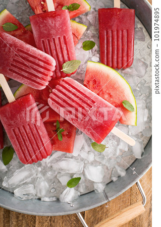 Watermelon and strawberry popsicles 101974895