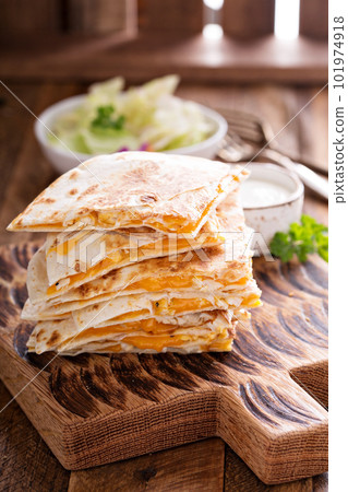 Quesadillas with cheddar and chicken Quesadillas with cheddar and chicken 101974918
