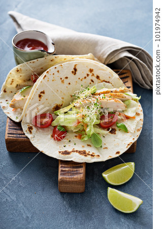 Chicken tacos with salad and tomatoes 101974942