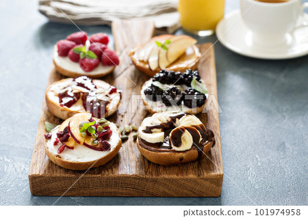 Variety of bagels on a board 101974958