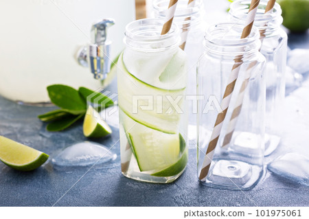 Lime and cucumber lemonade in bottles Lime and cucumber lemonade in bottles 101975061