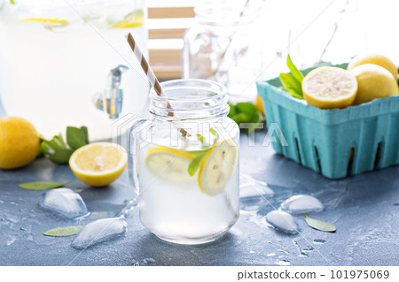 Fresh citrus lemonade in beverage dispenser Fresh citrus lemonade in beverage dispenser 101975069