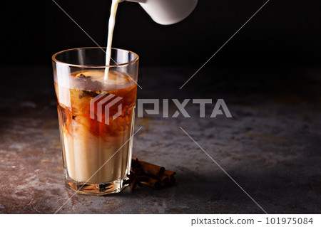 Hot masala tea with milk Hot masala tea with milk 101975084