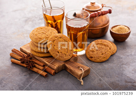 Cinnamon cookies with tea 101975239