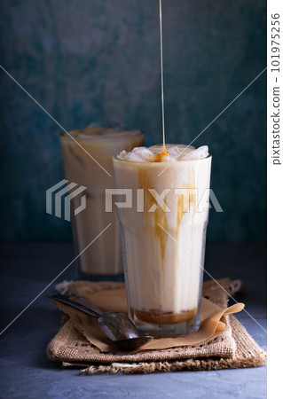 Iced coffee with milk in tall glasses 101975256