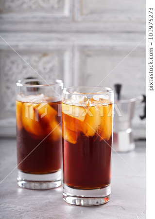 Iced coffee in tall glasses 101975273