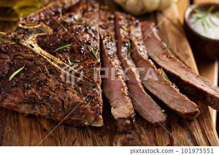 Beef steak cooked on a grill Beef steak cooked on a grill 101975551