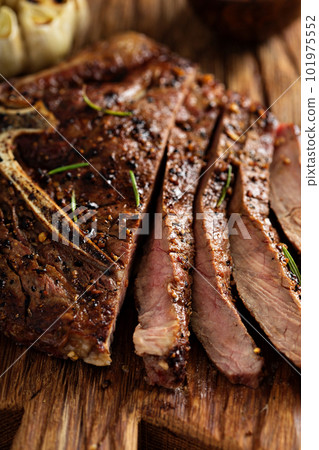 Beef steak cooked on a grill Beef steak cooked on a grill 101975552
